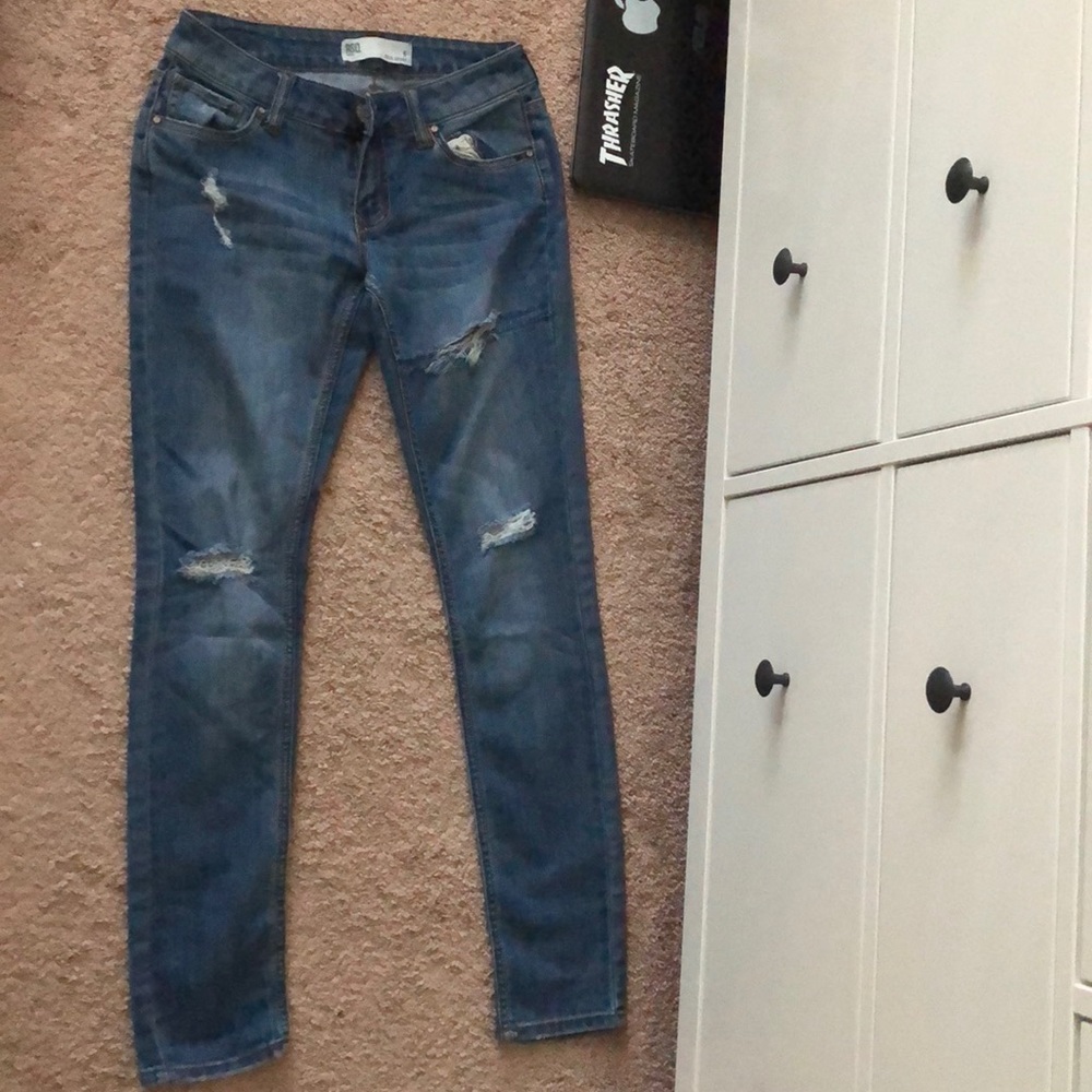 RSQ ripped skinny jeans.